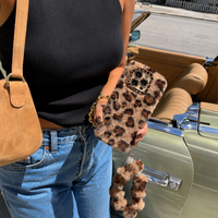 KASED Golden Jungle iPhone case – furry leopard plush, shown on iPhone