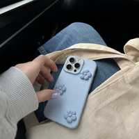 KASED Poppy Pop iPhone case – dopamine floral print, shown on iPhone