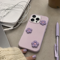 KASED Bloom Pop iPhone case – dopamine floral print, shown on iPhone