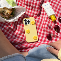 KASED Daisy Pop iPhone case – dopamine daisy print, shown on iPhone
