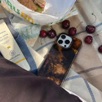 KASED Amber iPhone case – amber vortex swirl print, close-up detail