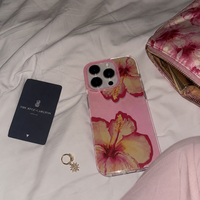 KASED Island Blush iPhone case – blush hibiscus floral print, shown on iPhone