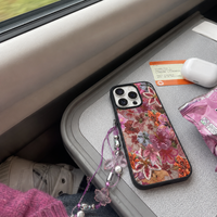 KASED Flora iPhone case – beaded floral texture, shown on iPhone