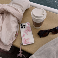 KASED Pressed Petals iPhone case – pressed-flower clear print, shown on iPhone