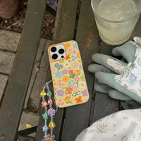 KASED Painted Petals iPhone case – oil-painting floral print, shown on iPhone